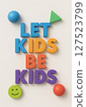 Bright and fun message reading Let Kids Be Kids with geometric shapes, emphasizing childhood freedom, fun, and expression.  127523799