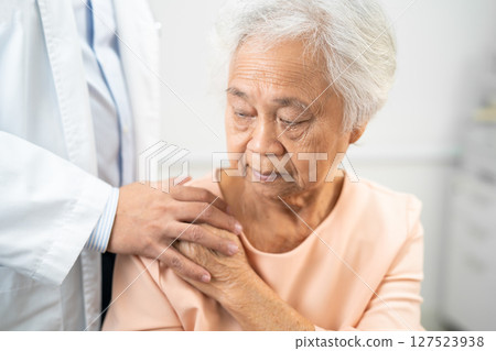 Caregiver holding hands Asian elderly woman patient with love, care, encourage and empathy at nursing hospital, healthy strong medical. Caregiver holding hands Asian elderly woman patient with love, care, encourage and empathy at nursing hospital, healthy strong medical. 127523938