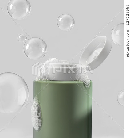 A green cosmetic bottle with shampoo or shower gel, surrounded by flying bubbles, is located on a serene background 127523969