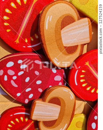 Multicolored vegetables for pizza made of fabric. 127524159