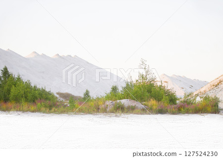 Beautiful landscape of white mountains and sand. Unusual natural landscape. Waste from old chemical production. Beautiful landscape of white mountains and sand. Unusual natural landscape. Waste from old chemical production. 127524230