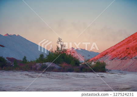 Fantastic landscape of red and white sandy mountains. Unusual natural landscape. Fantastic landscape of red and white sandy mountains. Unusual natural landscape. 127524231