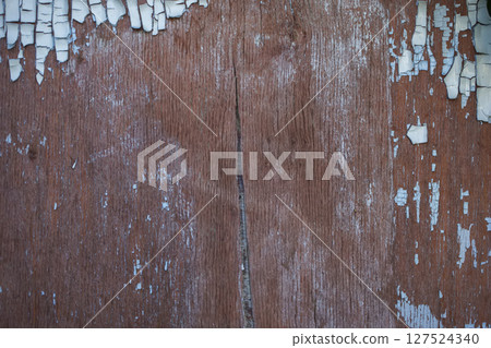 The texture of the wood plank with peeled paint. The texture of the wood plank with peeled paint. 127524340