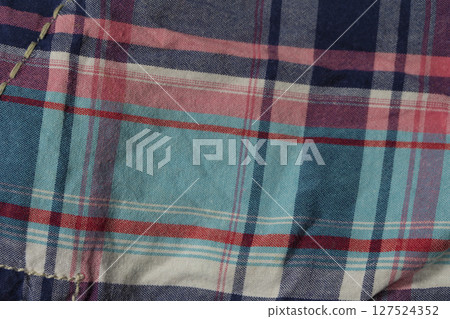 Texture of checkered cotton fabric close-up. Texture of checkered cotton fabric close-up. 127524352