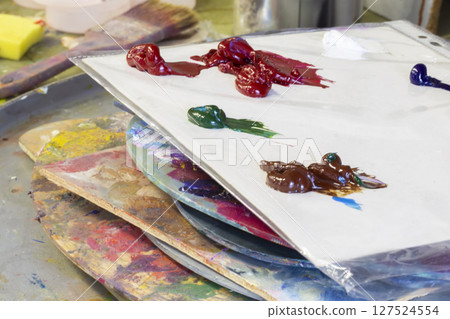 A palette of oil paints. Artist Desktop A palette of oil paints. Artist Desktop 127524554