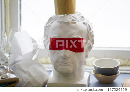 Caesar plaster head with red stripe on the eyes. 127524559