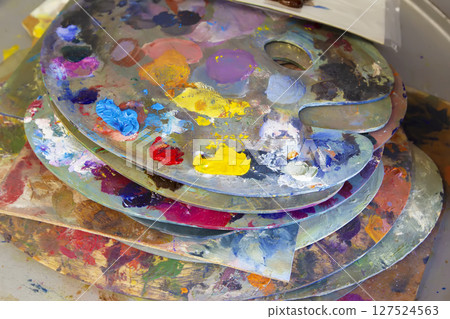 A palette of oil paints. Artist Desktop 127524563