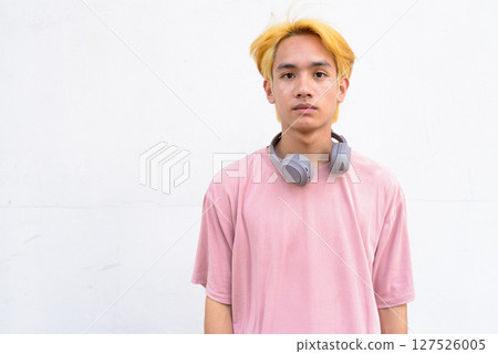 Thai gay teen man with pink shirt and septum ring Thai gay teen man with pink shirt and septum ring 127526005