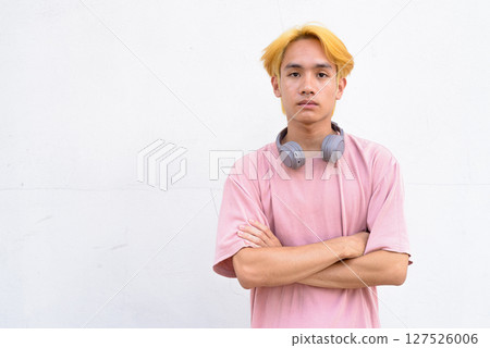 Thai gay teen man with pink shirt and septum ring Thai gay teen man with pink shirt and septum ring 127526006
