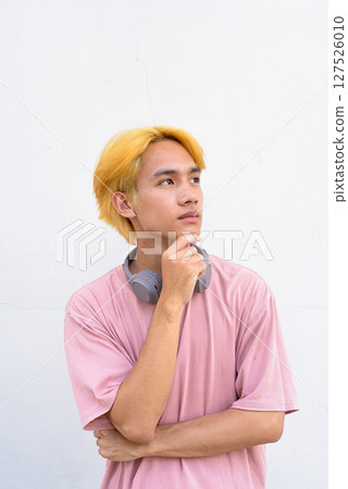 Thai gay teen man with pink shirt and septum ring Thai gay teen man with pink shirt and septum ring 127526010