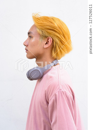 Thai gay teen man with pink shirt and septum ring Thai gay teen man with pink shirt and septum ring 127526011