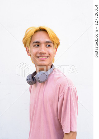 Thai gay teen man with pink shirt and septum ring Thai gay teen man with pink shirt and septum ring 127526014