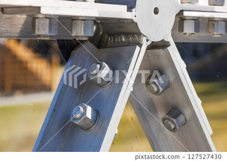 Close Up of Steel Beam Joint with Bolts in Industrial Structural Engineering 127527430