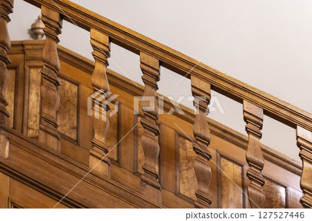 Elegant close-up of a beautifully carved wooden staircase 127527446