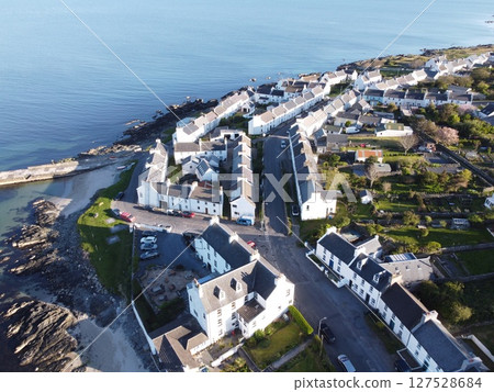 Port Charlotte is a town on the west coast of Islay, Scotland. Whisky distilleries and hotels dot the area, with scenic shorelines and historic charm. 127528684