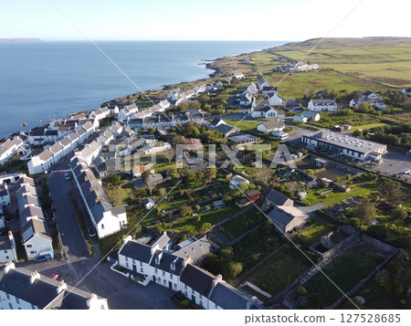 Port Charlotte is a town on the west coast of Islay, Scotland. Whisky distilleries and hotels dot the area, with scenic shorelines and historic charm. 127528685