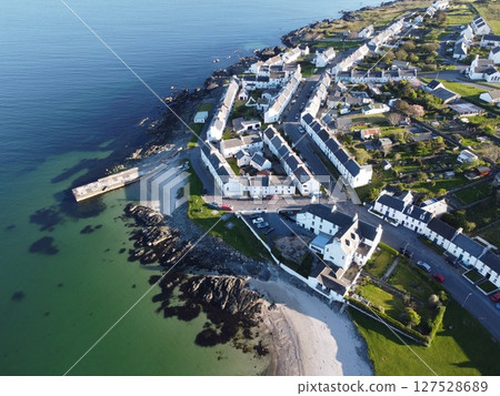Port Charlotte is a town on the west coast of Islay, Scotland. Whisky distilleries and hotels dot the area, with scenic shorelines and historic charm. 127528689