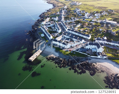Port Charlotte is a town on the west coast of Islay, Scotland. Whisky distilleries and hotels dot the area, with scenic shorelines and historic charm. 127528691