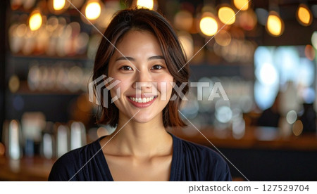 Beautiful woman with a night view in the background 127529704