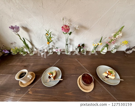 Coffee time among flowers 127530159