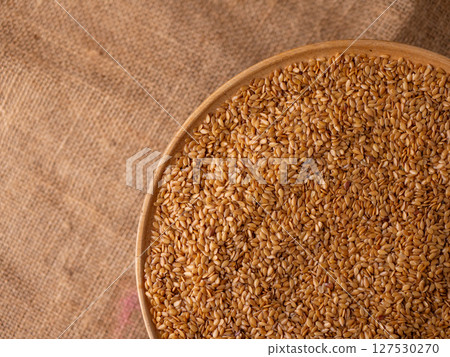 Organic golden flaxseed, linseed grains. Superfood high in fiber. 127530270