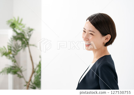 Woman in suit profile Woman in suit profile 127530755