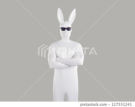 Portrait of unrecognizable person wearing white spandex costume and hare mask with long ears. Portrait of unrecognizable person wearing white spandex costume and hare mask with long ears. 127531241