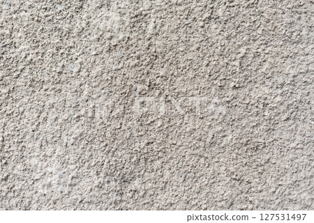 Rough white textured wall provides a detailed closeup of its uneven surface, suitable for backgrounds or design work. Unique structure and simplicity, it's ideal for creative projects Rough white textured wall provides a detailed closeup of its uneven surface, suitable for backgrounds or design work. Unique structure and simplicity, it's ideal for creative projects 127531497