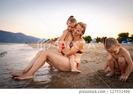 Enjoying a joyful summer evening at a Greek beach 127531498