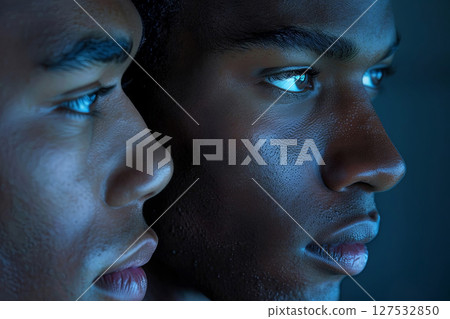 Two profiles captured in a stunning play of light and shadow, highlighting striking details and expressions 127532850