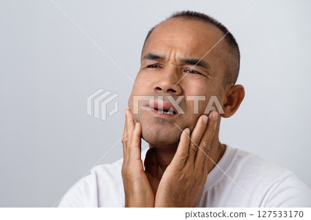 Man has facial swelling due to an allergic reaction to triggers such as insect bites, food Man has facial swelling due to an allergic reaction to triggers such as insect bites, food 127533170