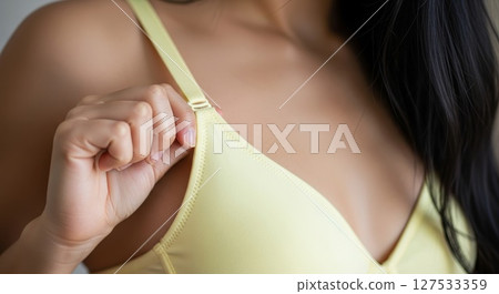 Woman Adjusting Yellow Tank Top Strap Closeup Fitness Comfort Woman Adjusting Yellow Tank Top Strap Closeup Fitness Comfort 127533359