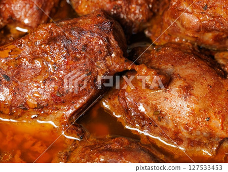 Savory roasted meat infused with spices and cooked to perfection in a rich broth Savory roasted meat infused with spices and cooked to perfection in a rich broth 127533453