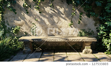 Stone garden bench with ivy shadows . 127533803