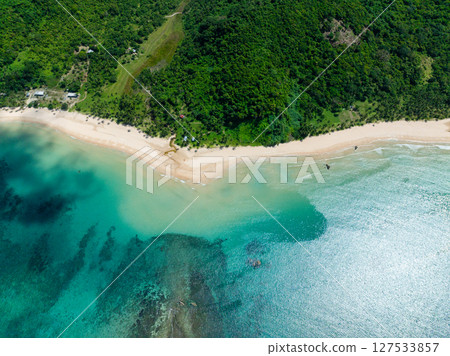 Clear turquoise sea water and waves in Nacpan Beach. El Nido, Palawan. Philippines. 127533857