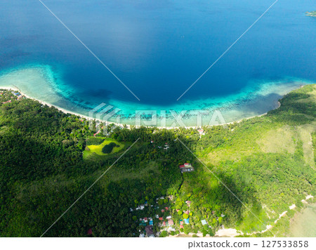 Sandy beach with turquoise sea water in Logbon Island. Romblon, Philippines. 127533858