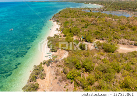 Corals and blue sea in Bantayan Island. Clear water and white sands in Sandira Beach. Cebu, Philippines. Corals and blue sea in Bantayan Island. Clear water and white sands in Sandira Beach. Cebu, Philippines. 127533861