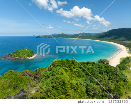 Islet with corals and waves on Nacpan Beach in El Nido, Philippines. Islet with corals and waves on Nacpan Beach in El Nido, Philippines. 127533863