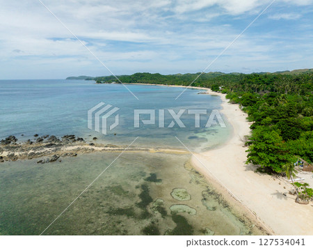 Transparent sea water and waves on white sand beach. Santa Fe, Tablas, Romblon. Philippines. 127534041