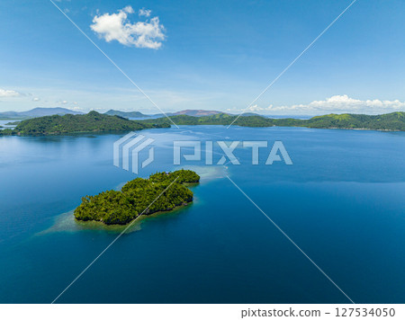 Beautiful deep blue sea in the islands and blue skies and clouds. Mindanao, Philippines. Travel and summer concept. Beautiful deep blue sea in the islands and blue skies and clouds. Mindanao, Philippines. Travel and summer concept. 127534050