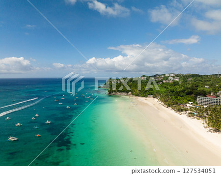 Scenic landscape of white sand beach and tourist boats running over clear water. Boracay Island. Philippines. Scenic landscape of white sand beach and tourist boats running over clear water. Boracay Island. Philippines. 127534051