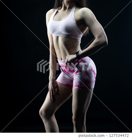 athletic female body on dark background, fitness woman, athletic girl torso athletic female body on dark background, fitness woman, athletic girl torso 127534472