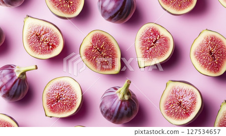 Fresh figs cut in half on pink background, copy space, pattern 127534657