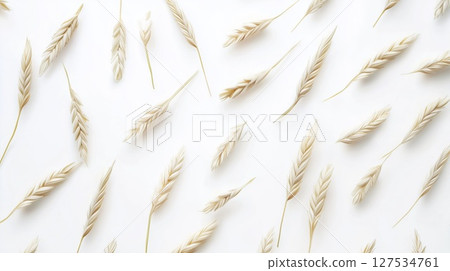 Wheat ears in elegant pattern on white background, top view, copy space 127534761