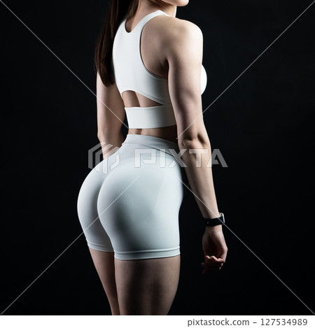 athletic female body on dark background, fitness woman, athletic girl torso athletic female body on dark background, fitness woman, athletic girl torso 127534989