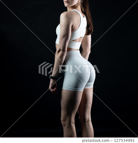 athletic female body on dark background, fitness woman, athletic girl torso athletic female body on dark background, fitness woman, athletic girl torso 127534991