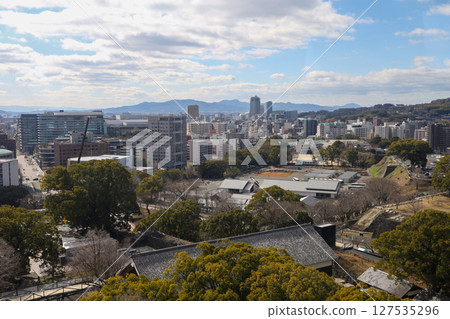 Kumamoto, Japan - January 25, 2023: Landscape of Kumamoto city from Kumamoto castle. Kumamoto is the capital city in Kyushu, Japan. Kumamoto, Japan - January 25, 2023: Landscape of Kumamoto city from Kumamoto castle. Kumamoto is the capital city in Kyushu, Japan. 127535296