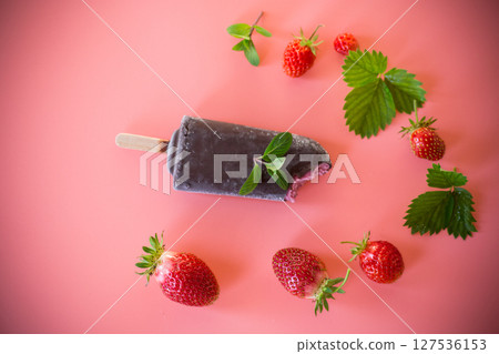 Refreshing ice cream with strawberries and mint leaves 127536153