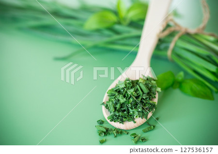 Top view of dried herbs and fresh green onions 127536157