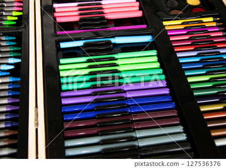 a box of art supplies with a variety of pens and pencils a box of art supplies with a variety of pens and pencils 127536376